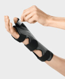 Fastening strap for securing the thumb in place The thumb pocket of the Palmar Xtec Rhizo wrist orthosis being fastened in place