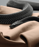 3. Lifestyle image Juzo Move Juzo Move with a black snake
