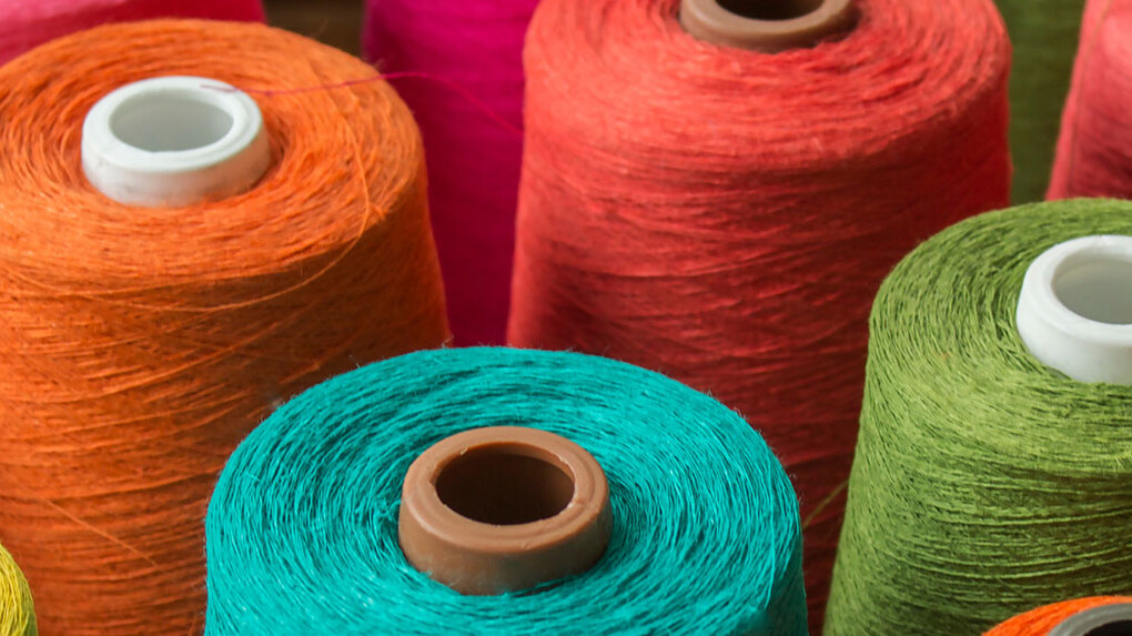 Bobbins with different coloured threads Bobbins with different coloured threads